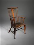 A George III West Country comb back armchair. 