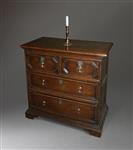 A small Queen Anne oak chest of drawers