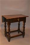A very small William and Mary drop leaf table.