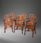 A matched set of six yew wood Windsor armchairs.