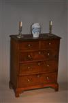 A very small George II oak chest of drawers. 