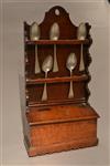 A George III oak and fruitwood spoon rack.
