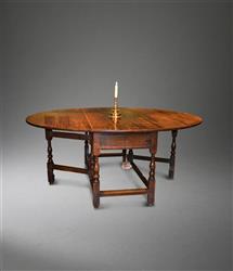 A Queen Anne large oak gateleg table.
