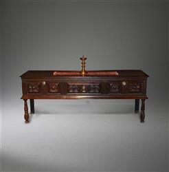 An impressive Charles II oak low dresser.