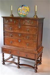 A Queen Anne oak chest on stand.