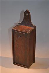 A simple George III oak candlebox.