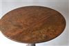 A primitive George II oak tripod table. 