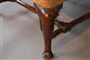 An early 18th century walnut leg wing chair.