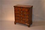 A tiny early 18th century walnut bachelor's chest.