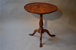 A mid 18th century burr elm tripod table.