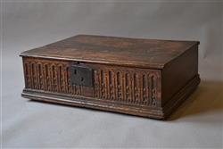 A Charles I oak boarded box with later stand.