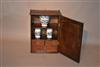 A small George III oak wall cupboard.