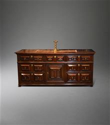 An impressive Charles II oak low dresser. 