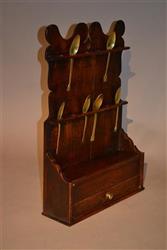 A George III oak spoon rack.