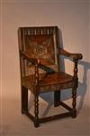 A Charles I oak armchair.