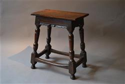A rare early 17th century oak joint stool.