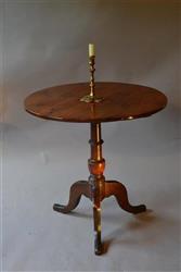 A George III yew wood tilt top pedestal table.