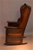 A George III oak hooded wing chair.