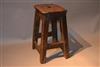 An early 19th century elm and pine stool.