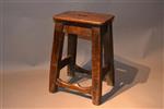 An early 19th century elm and pine stool.