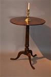 An elegant George III oak pedestal table.