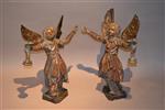 A very rare pair of carved and polychromed angels.