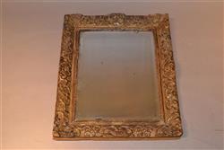 A Queen Anne giltwood mirror.