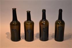 A collection of four ASCR wine bottles.