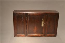 A very small George III oak wall cupboard.